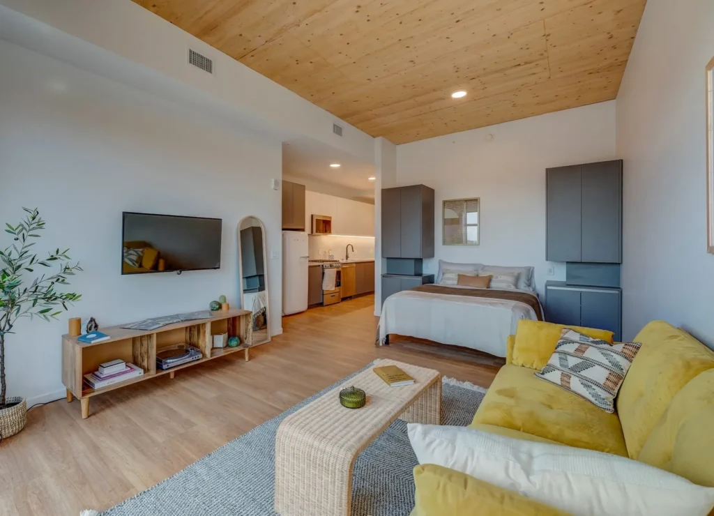 An INTRO residence with exposed glulam timber ceilings, floor-to-ceiling windows and skyline views