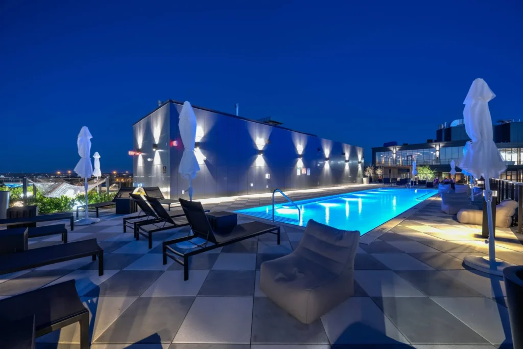 INTRO's zero-edge rooftop pool at dusk with the Cleveland skyline